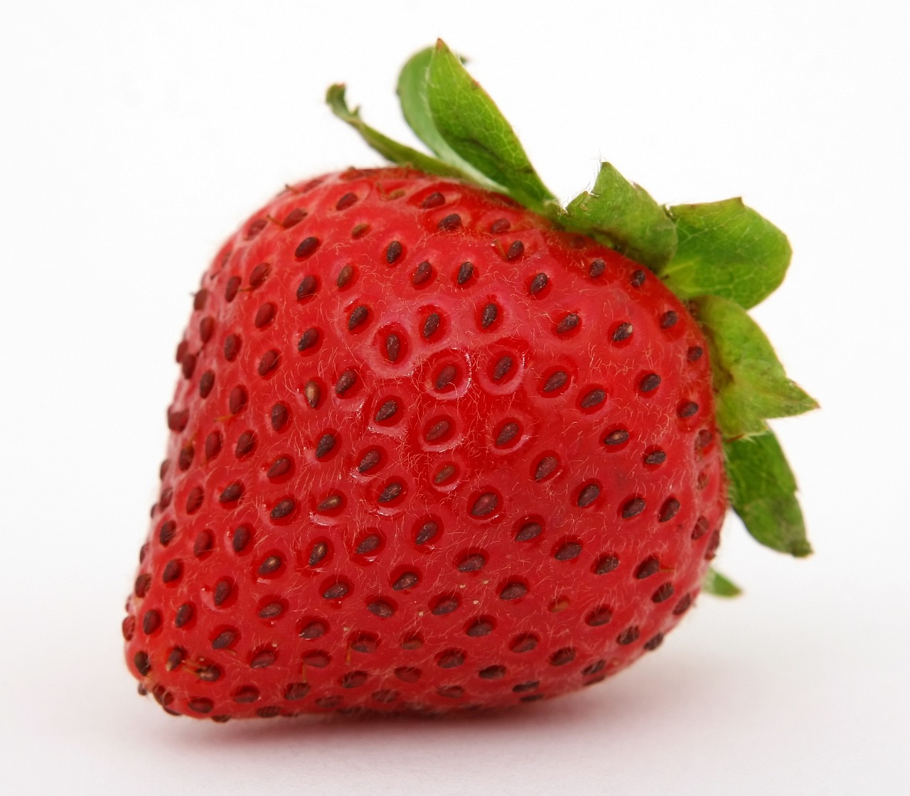 a close up of a strawberry on a white surface, a picture, by Matt Stewart, hurufiyya, istockphoto, ear, really realistic, aaaaaaaaaaaaaaaaaaaaaa