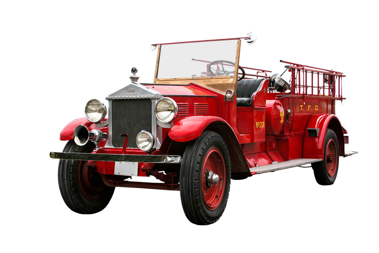 a red fire truck on a black background, a colorized photo, by Kanō Tan'yū, pixabay, art deco, with a roof rack, manufactured in the 1920s, vintage - w 1 0 2 4, the fire king