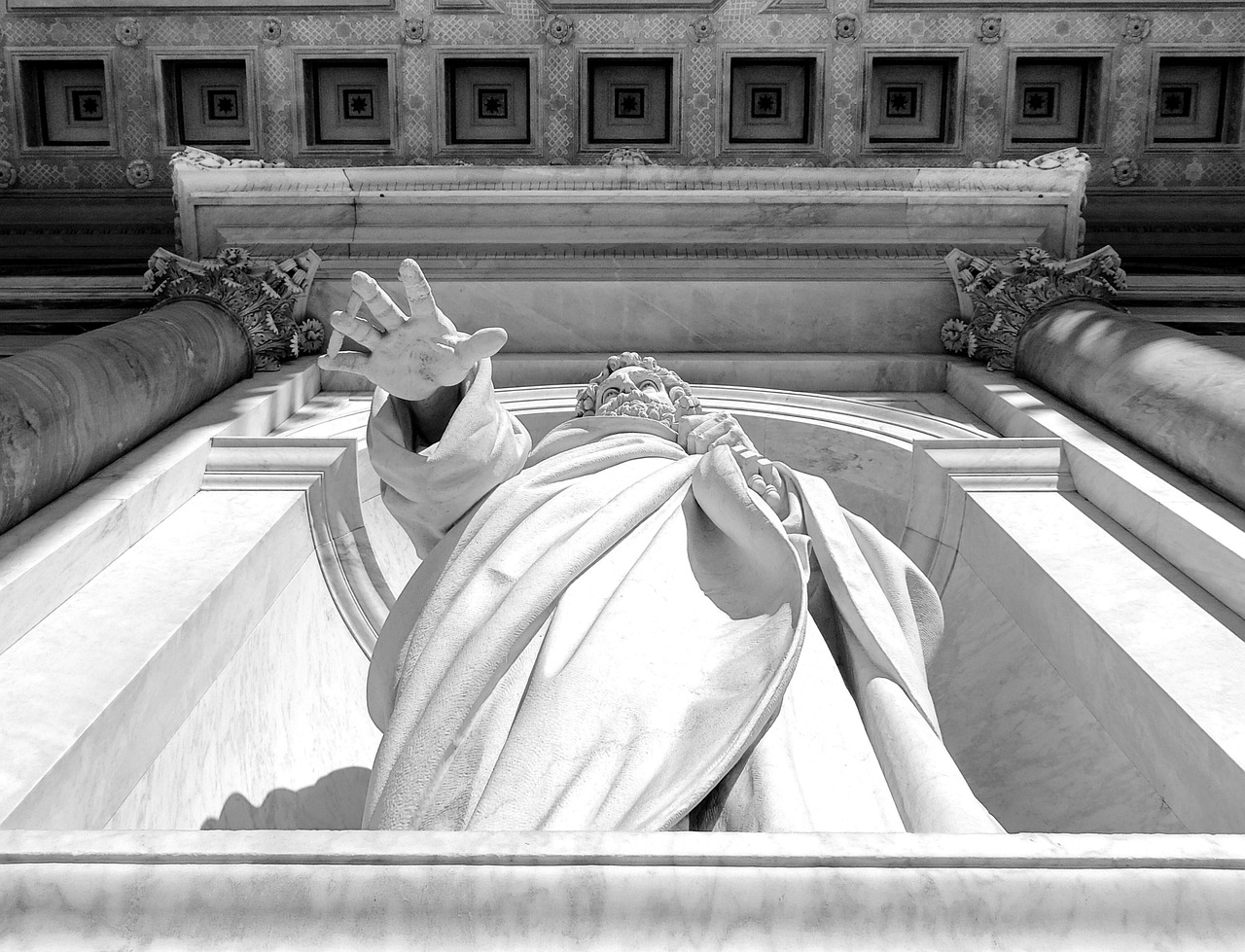 a black and white photo of a statue in front of a building, a marble sculpture, inspired by Antonio Canova, pixabay contest winner, waving robe movement, his hands buried in his face, library of congress, marble!! (eos 5ds r