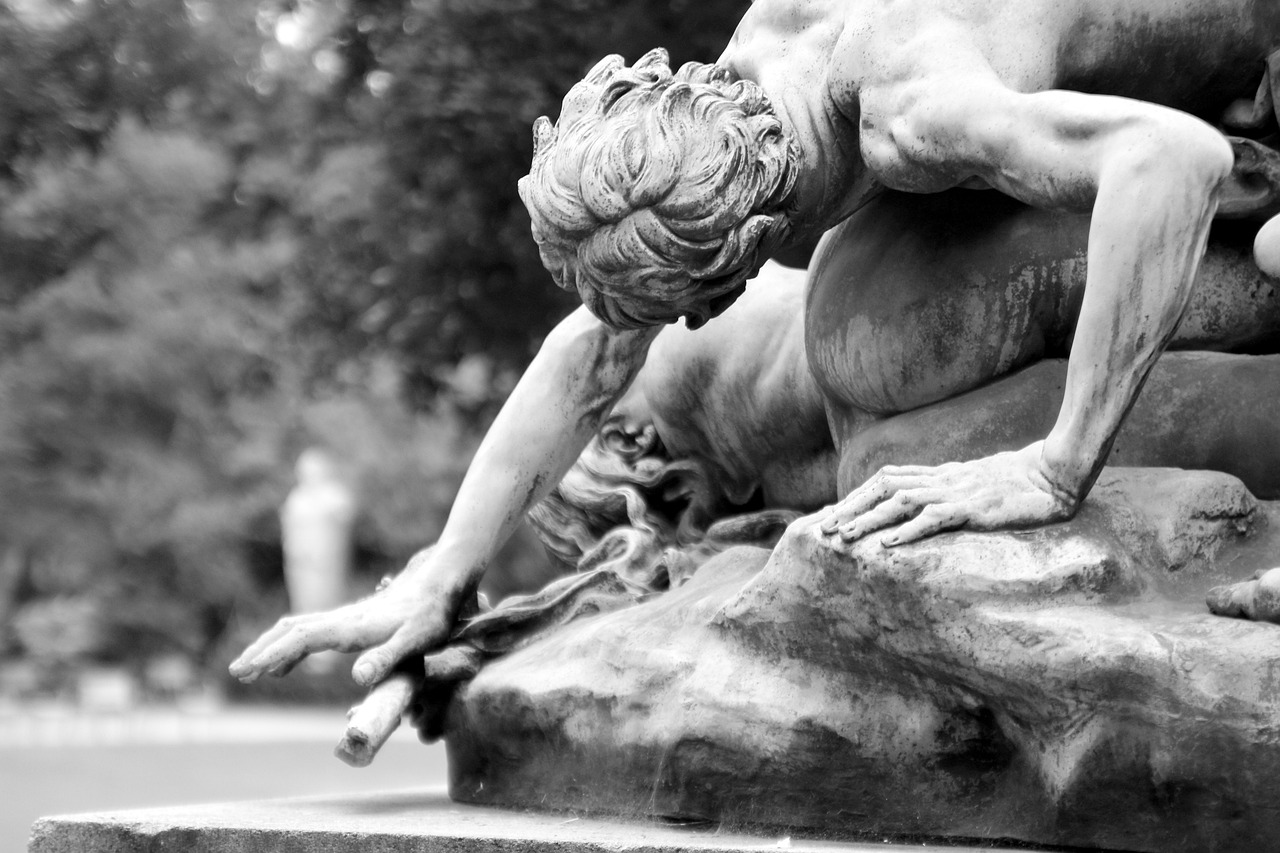 a black and white photo of a statue, inspired by Michelangelo Unterberger, pexels contest winner, romanticism, myth of narcissus, fauns, summer evening, injured