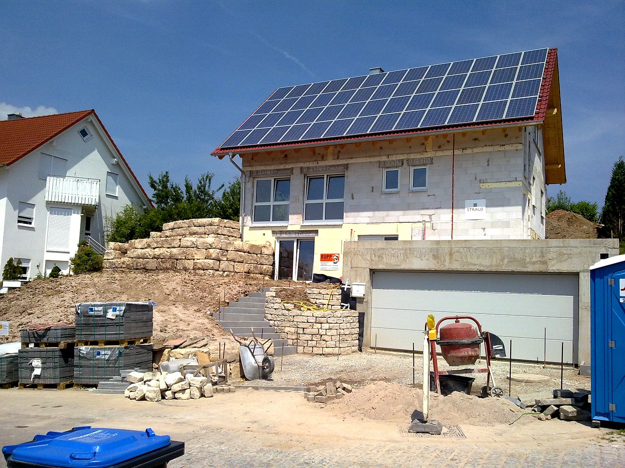 a house with a solar panel on the roof, by Robert Zünd, under construction, not cropped, garage, blog-photo
