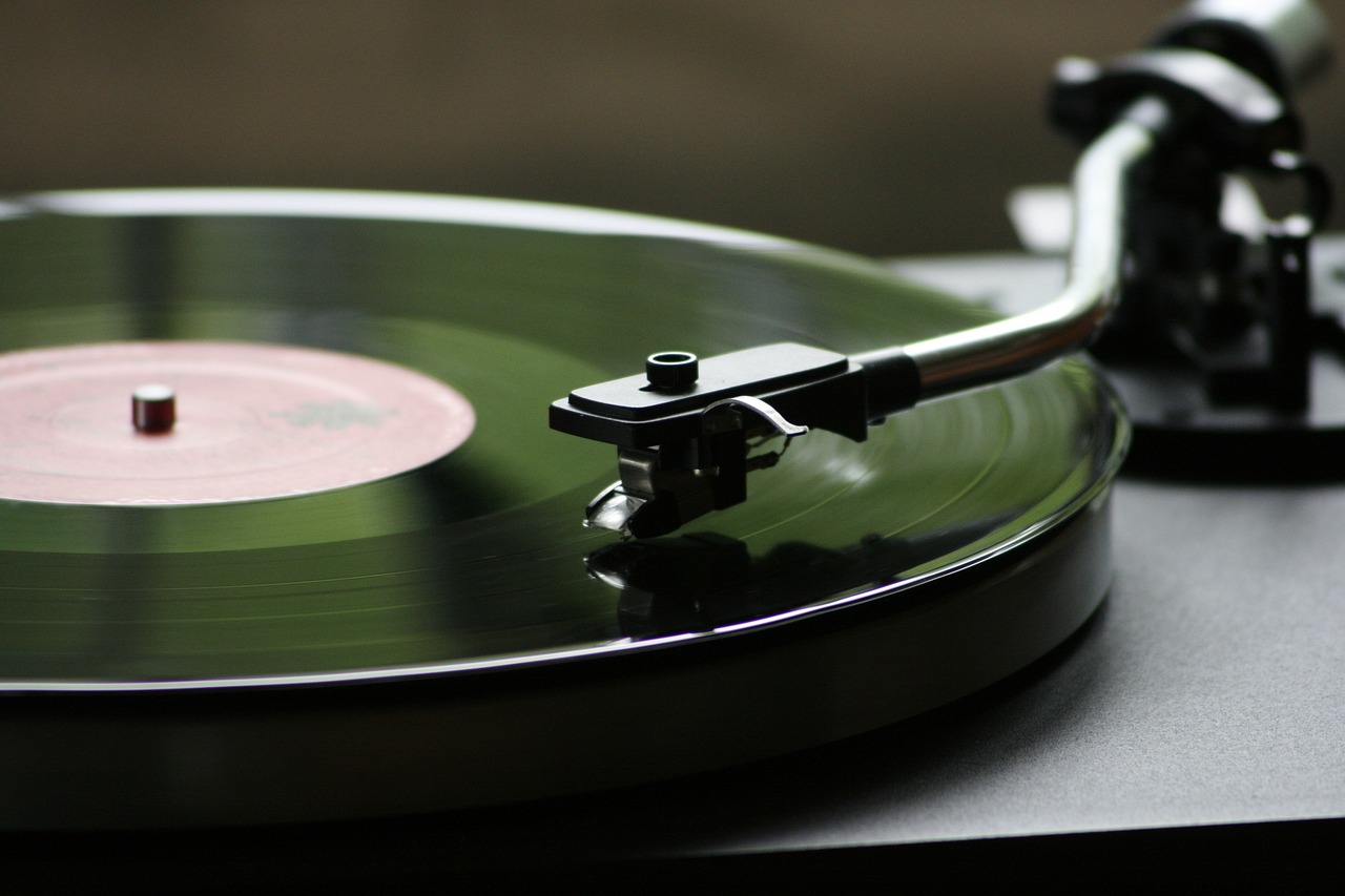 a close up of a record on a turntable, a picture, iphone wallpaper, packshot, musical instruments, profile close-up view