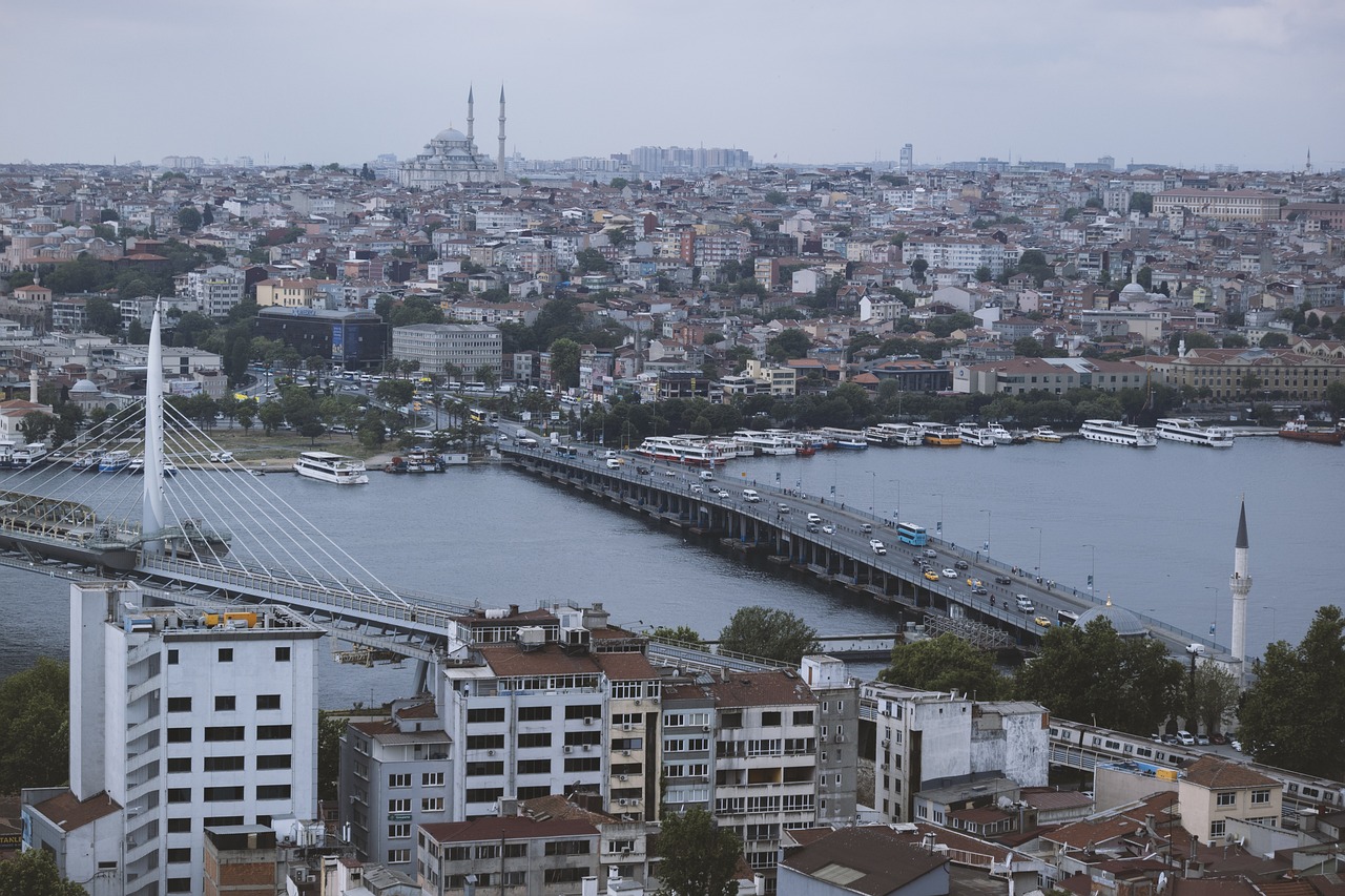 a view of a bridge over a large body of water, by Nadim Karam, shutterstock, hurufiyya, megacity streets seen from above, turkey, stock photo, bleak