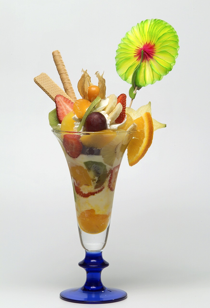 a glass filled with fruit and ice cream, inspired by Johannes Martini, high quality product photo, made out of sweets, tropical fruit, product introduction photo