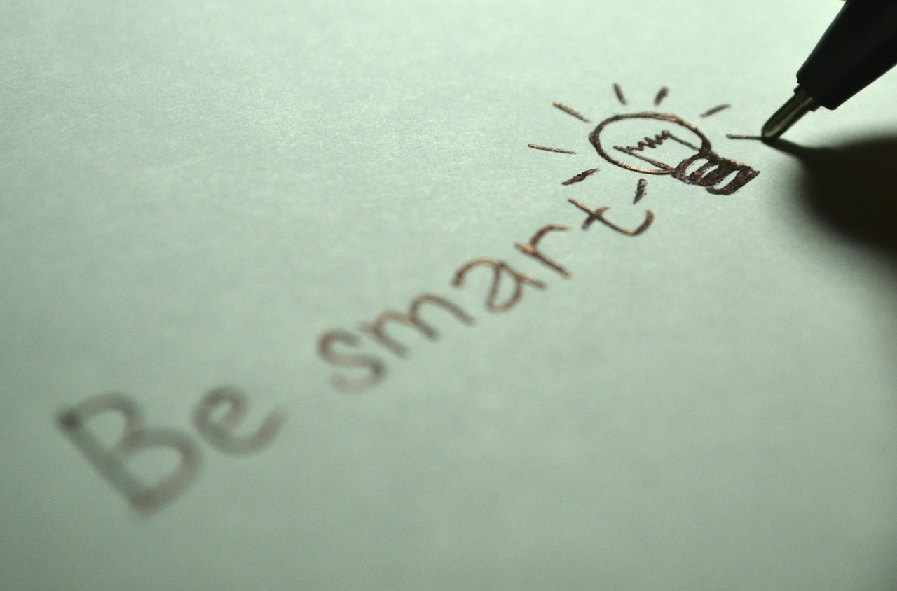 a person writing on a piece of paper with a pen, by Adam Marczyński, pixabay, graffiti, light bulb, smart ants, saying, looking smart