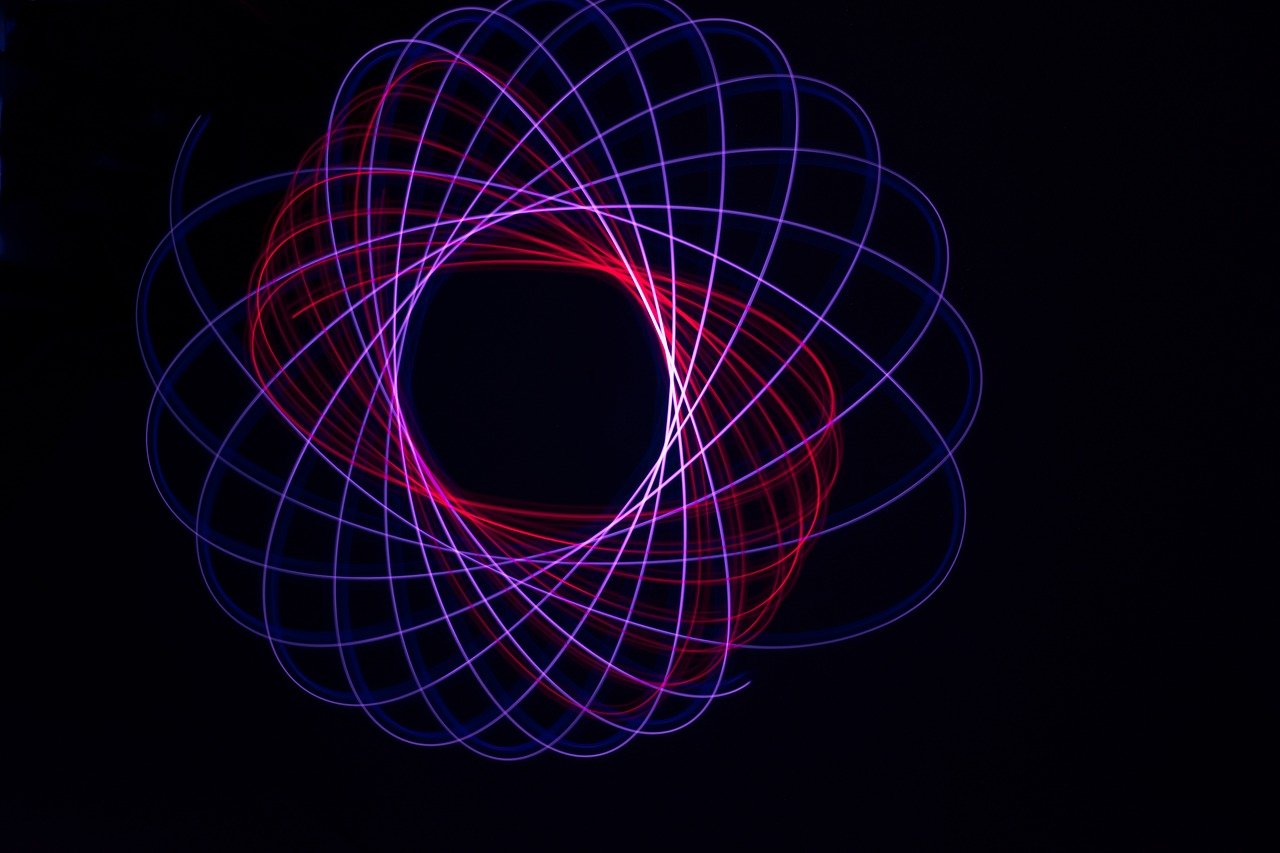 a close up of a light painting in the dark, a microscopic photo, geometric curves, purple and red colors, ringflash, atom