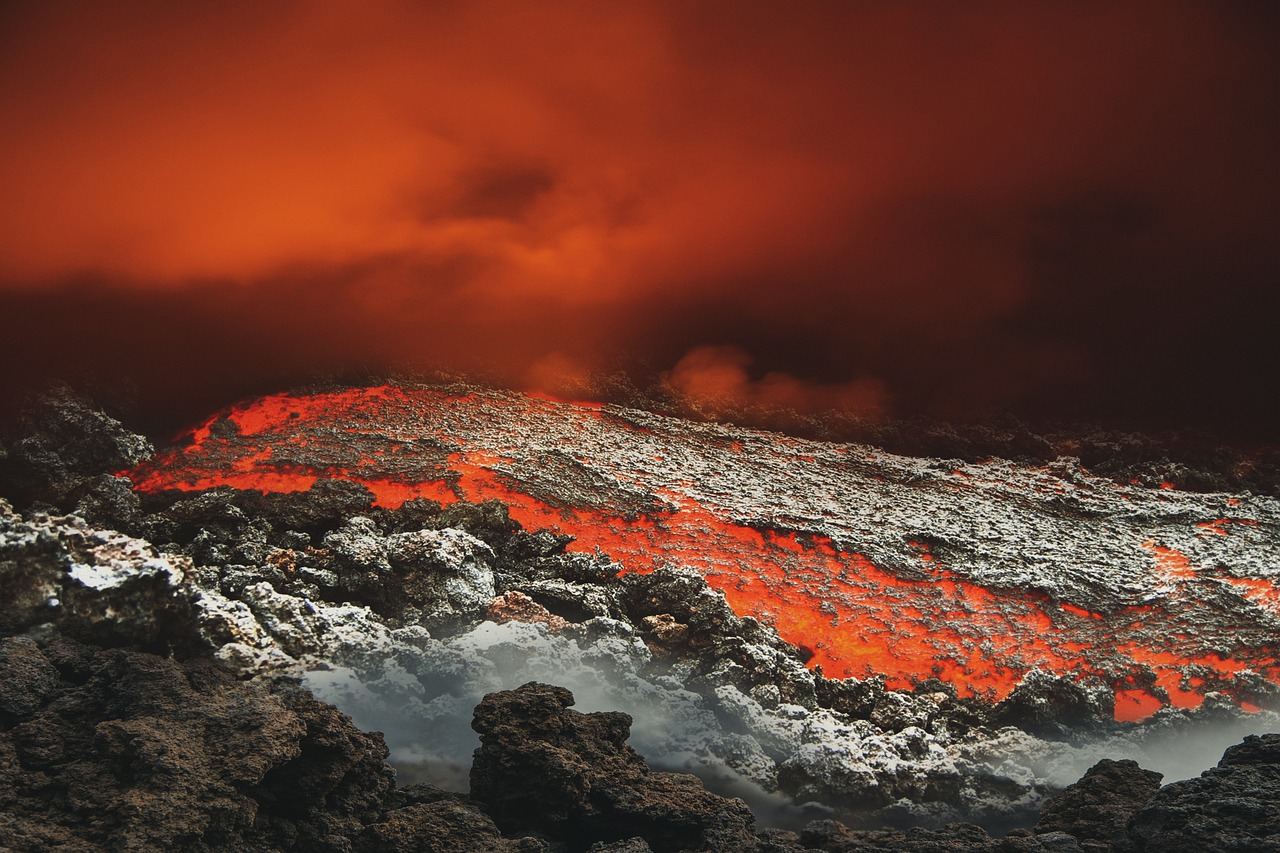 a mountain covered in lava and lava with a red sky in the background, a photo, by Adam Marczyński, fine art, 1128x191 resolution, burning fire embers, white lava, volcanic workshop background