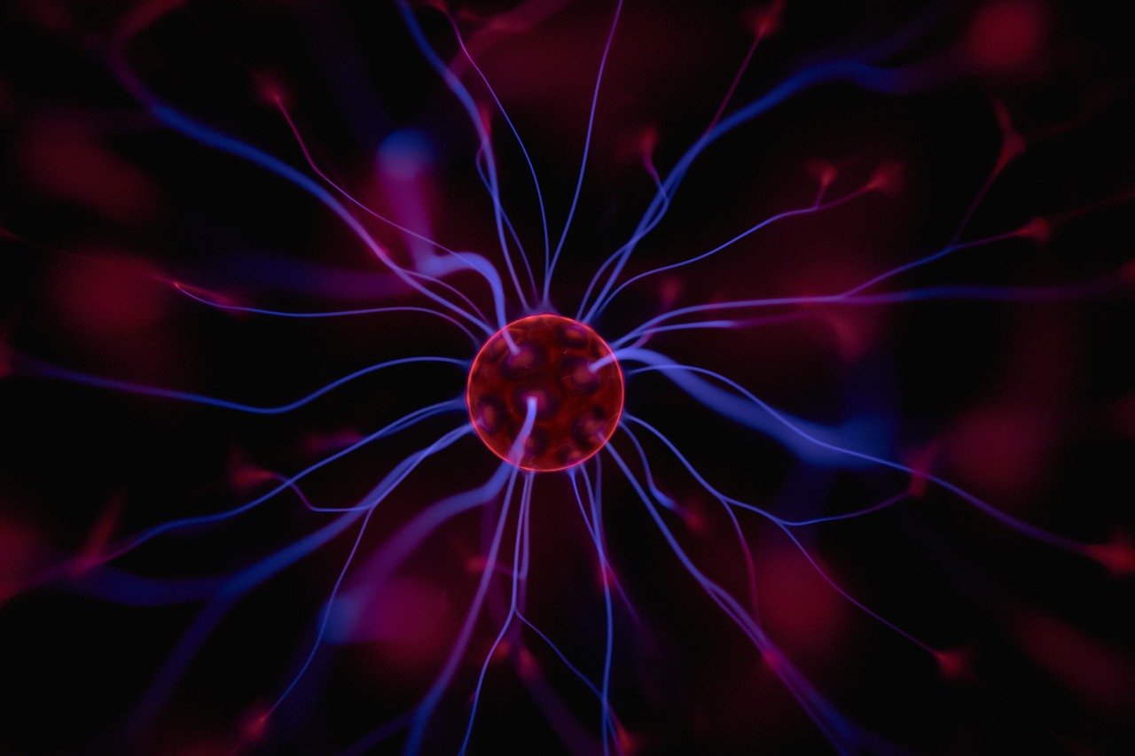 a close up of a cell on a black background, a digital rendering, immortal neuron, light red and deep blue mood, electricity superpowers, jellyfish element