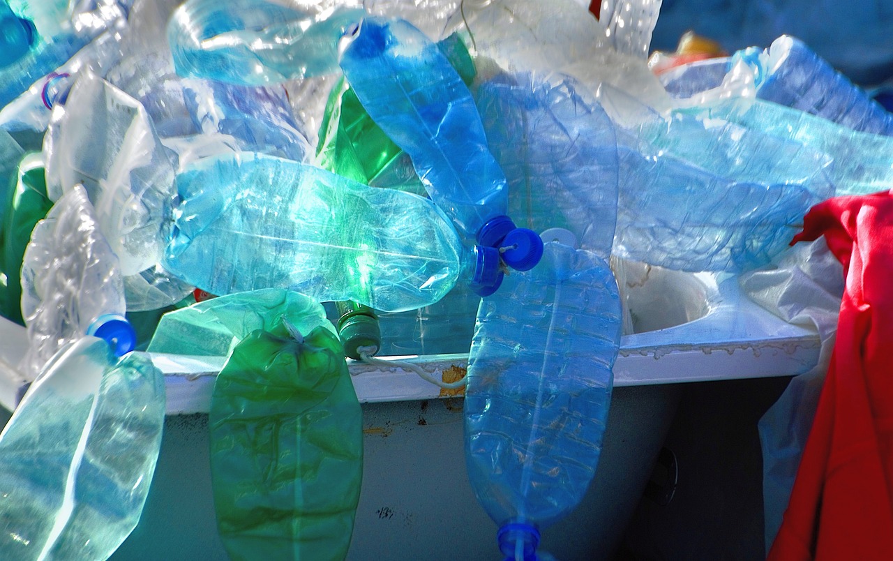 a bunch of plastic bottles sitting next to each other, by Matija Jama, flickr, bag, green and blue colors, mmmmm, vessels