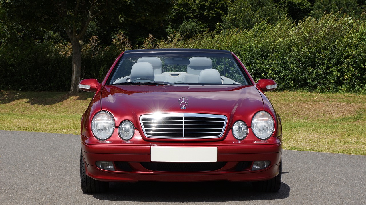 a red mercedes benz benz benz benz benz benz benz benz benz benz benz benz benz benz benz, a portrait, by Julian Allen, shutterstock, renaissance, taken in the late 2000s, convertible, esher, a long-shot from front