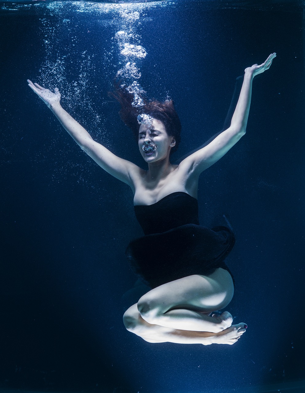 a woman in a black dress is under water, a portrait, by Jan Rustem, unsplash, lu ji, excitement, benjamin vnuk, david febland
