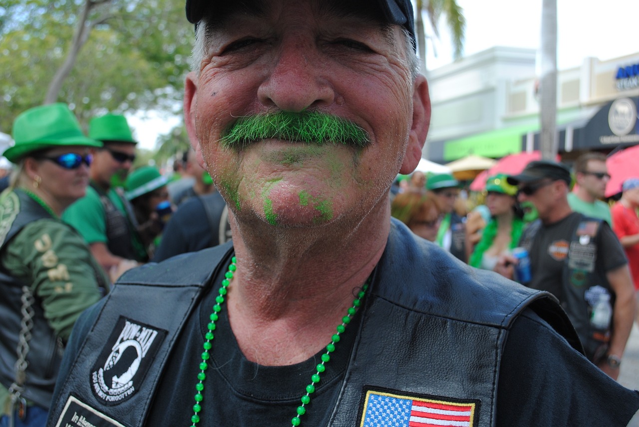 a man with a green moustache on his face, by Bernie D’Andrea, symbolism, biker, miami, irish, green slime everywhere