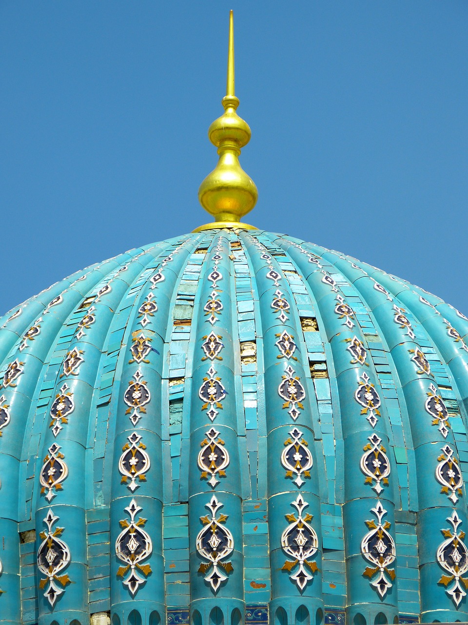 a blue and gold dome with a clock on top, a mosaic, by Kamāl ud-Dīn Behzād, shutterstock, roofing tiles texture, turquoise palette, turban, teal white gold color palette