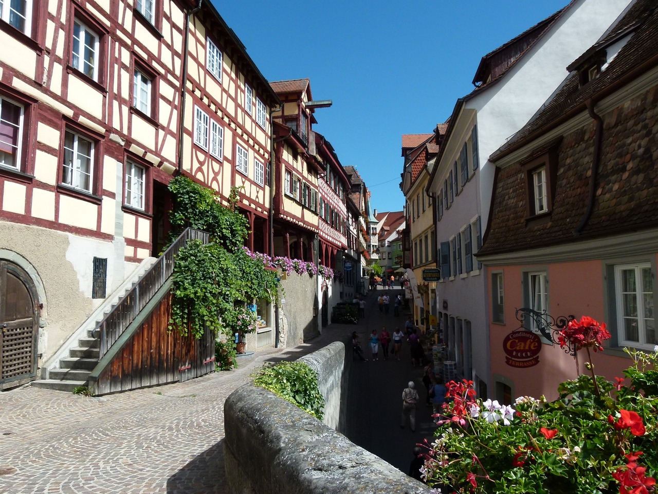 a couple of buildings that are next to each other, by Sigmund Freudenberger, flickr, renaissance, built on a steep hill, flowers, ox, warhammrer