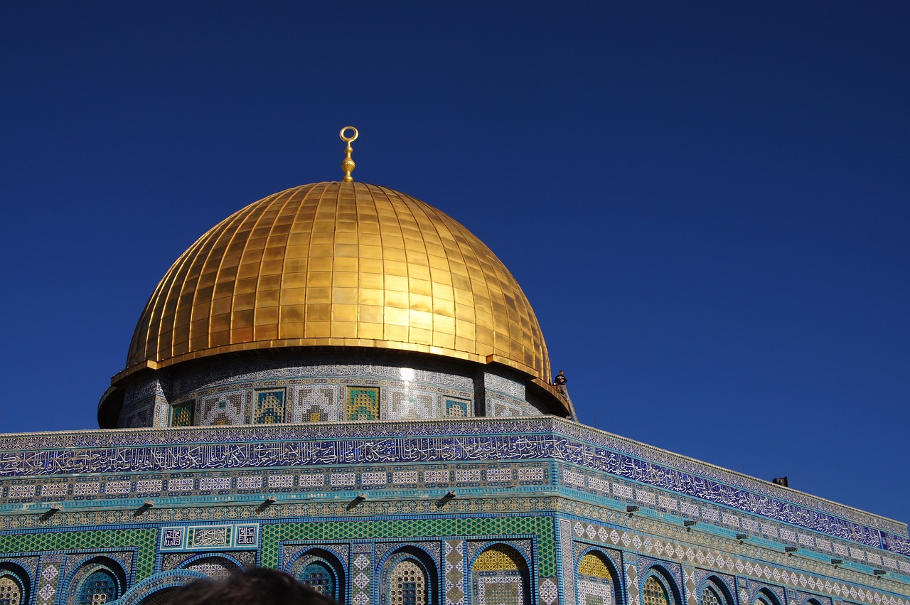 a close up of a dome on top of a building, a mosaic, by Elias Goldberg, trending on pixabay, unilalianism, dome of the rock, bathed in golden light, muslim, golden apple