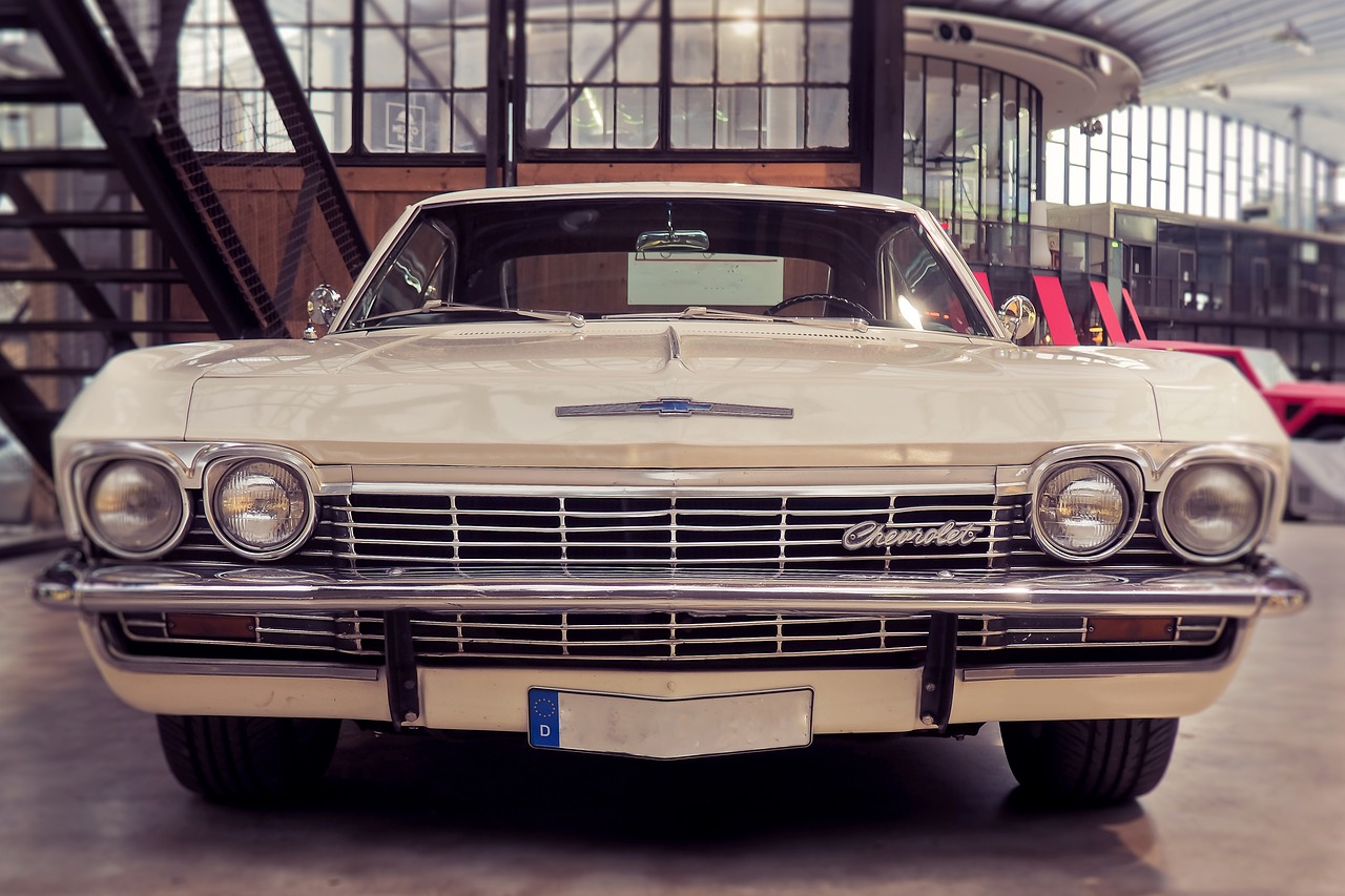 a classic car is parked in a garage, a portrait, unsplash, arabesque, insanely detailed c 10.0, anato finnstark. front view, 1 9 6 5 lightning, very sad c 12.0