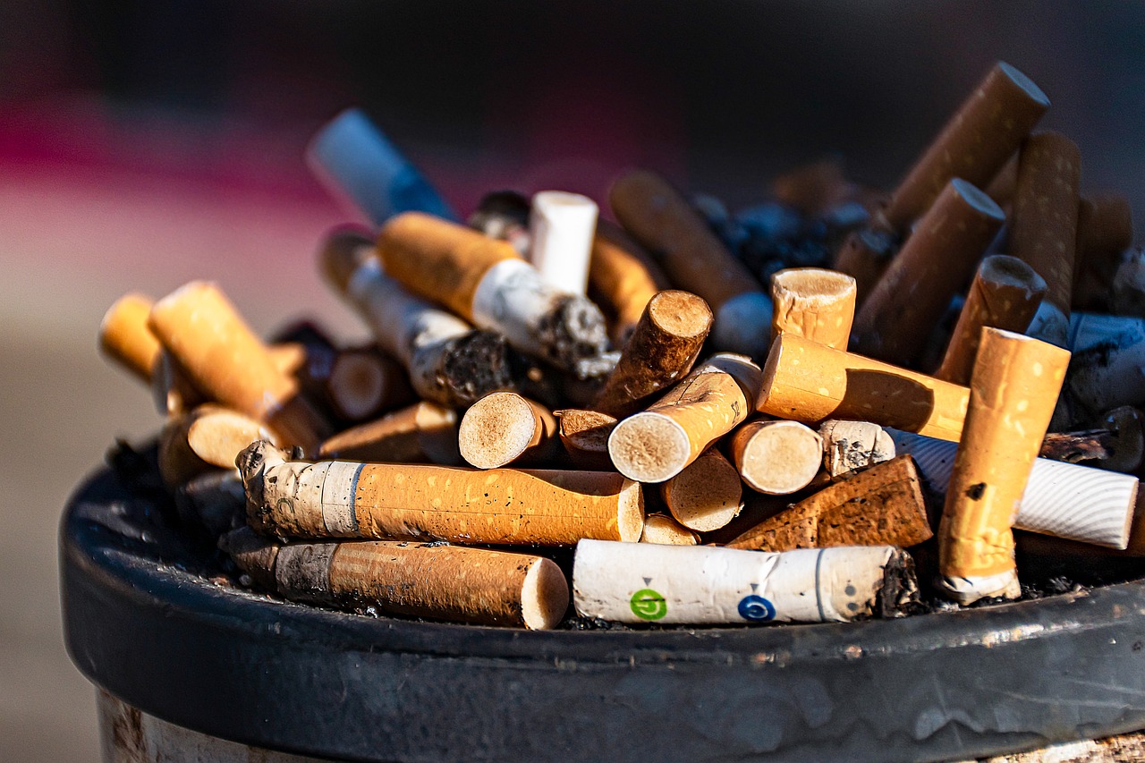 a black trash can filled with lots of cigarettes, shutterstock, happening, s'mores, 🔥 😎 🕹️ 👀 :2, environmental shot, artistic photo