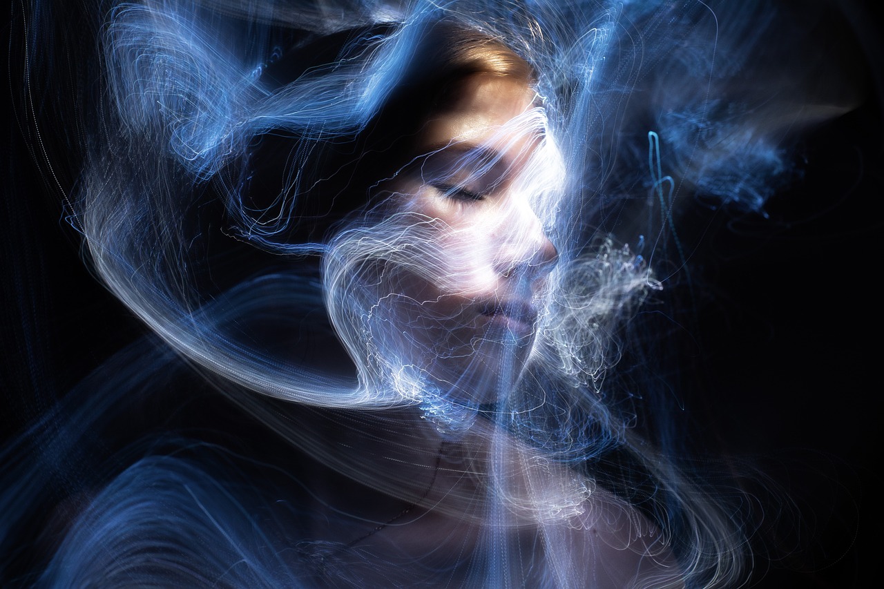 a close up of a person with smoke in the air, digital art, by Eugeniusz Zak, shutterstock, hair made of shimmering ghosts, blue rays of light, high quality fantasy stock photo, floating in perfume