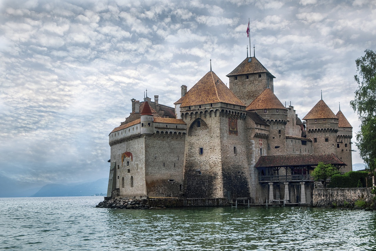 a castle sitting on top of a body of water, renaissance, swiss modernizm, on a cloudy day, the middle ages, yet unrecognizable