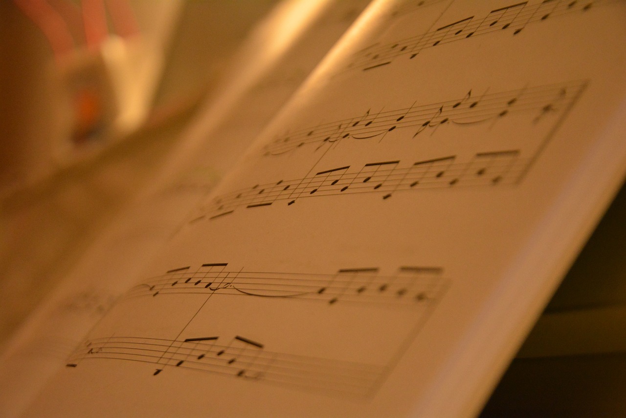 a sheet of music sitting on top of a table, by Thomas Häfner, flickr, close up shots, soft glow, studies, various styles