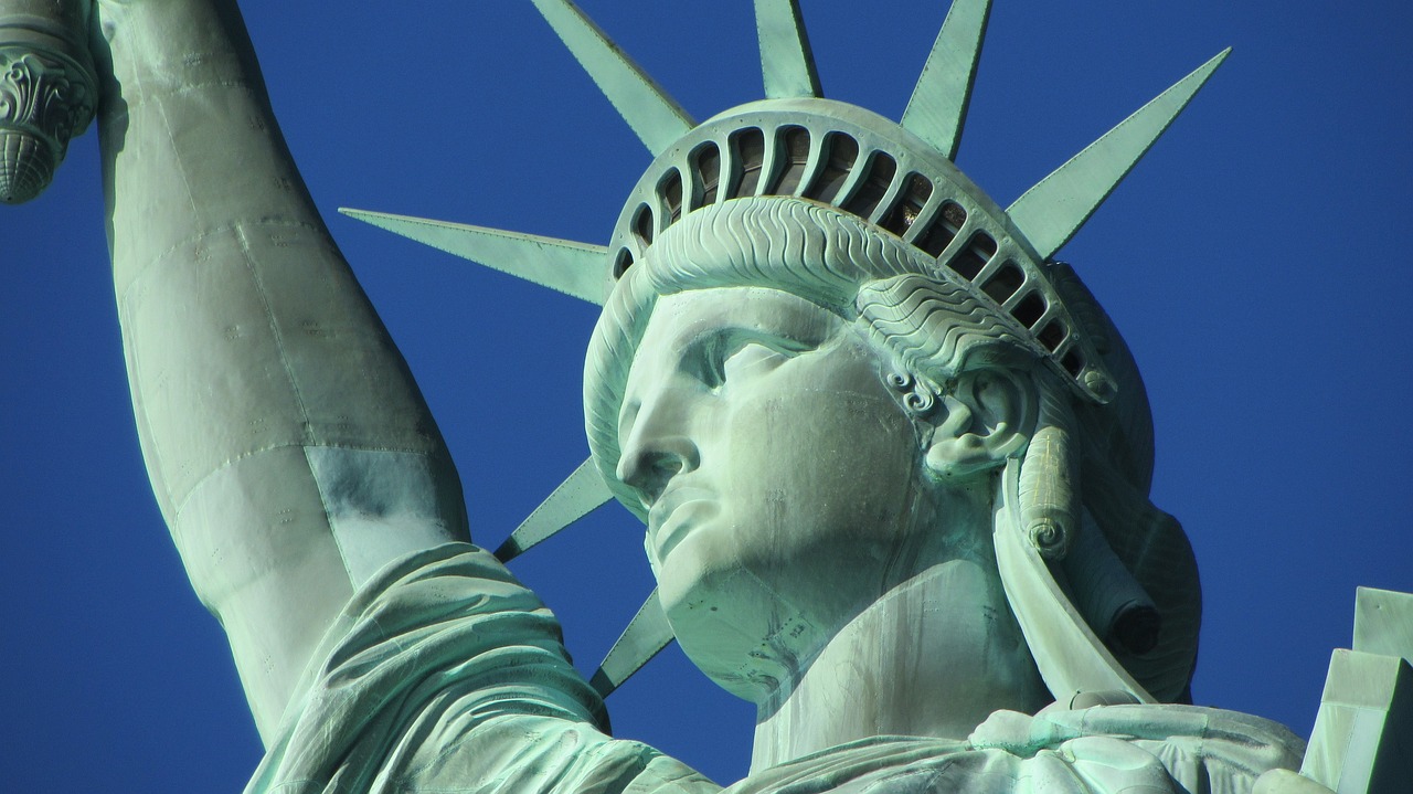 a close up of the head of a statue of liberty, a statue, by Luis Miranda, pexels, art nouveau, wikimedia, bottom angle, uncle sam, right side profile