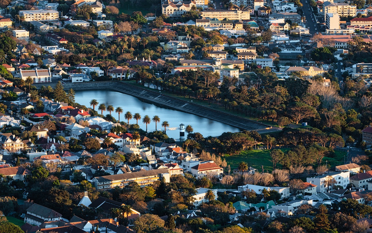 a view of a city from a bird's eye view, by Dave Melvin, hurufiyya, winter sun, lagoon, zeiss 18mm f2.8, morning detail