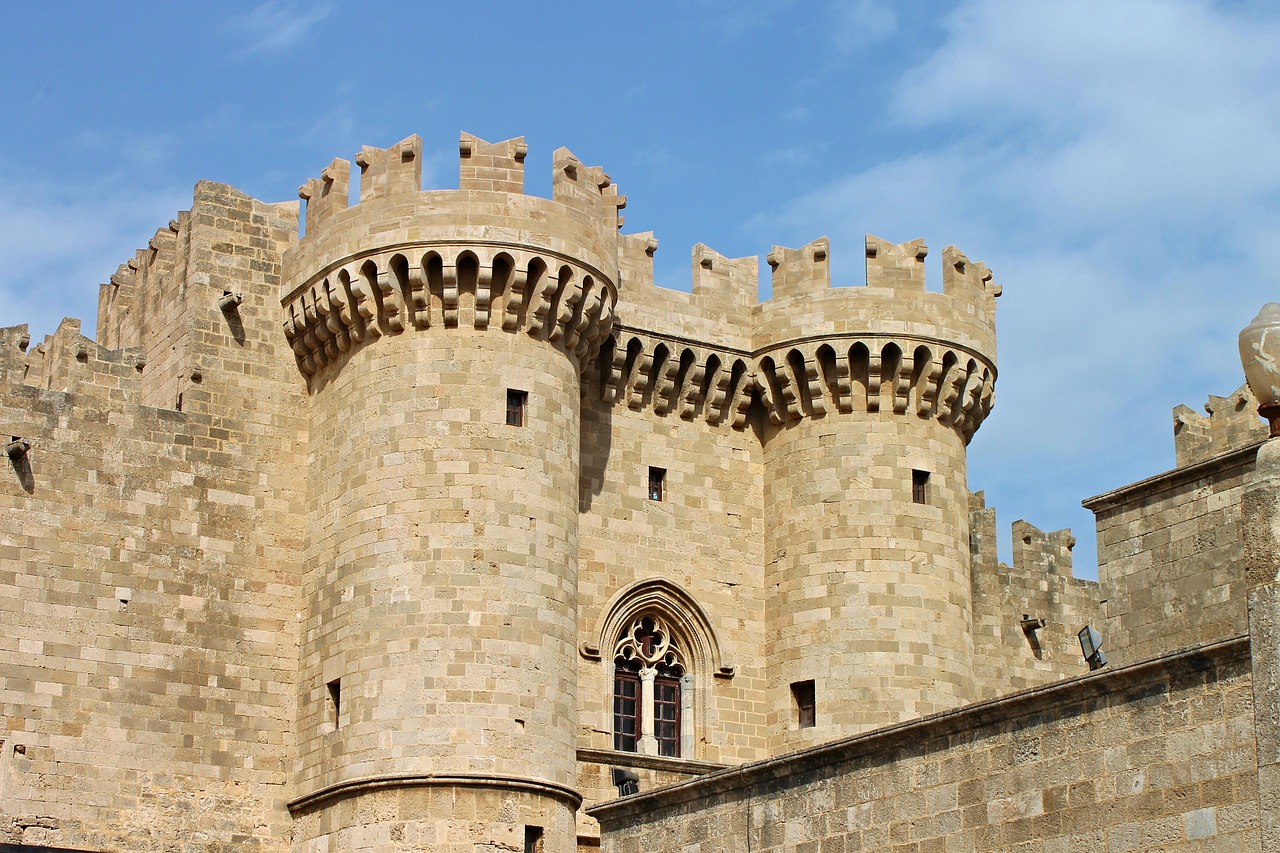 a large stone castle with a clock tower, alexandria\'s genesis, medieval gates, symmetrical detail, from of thrones