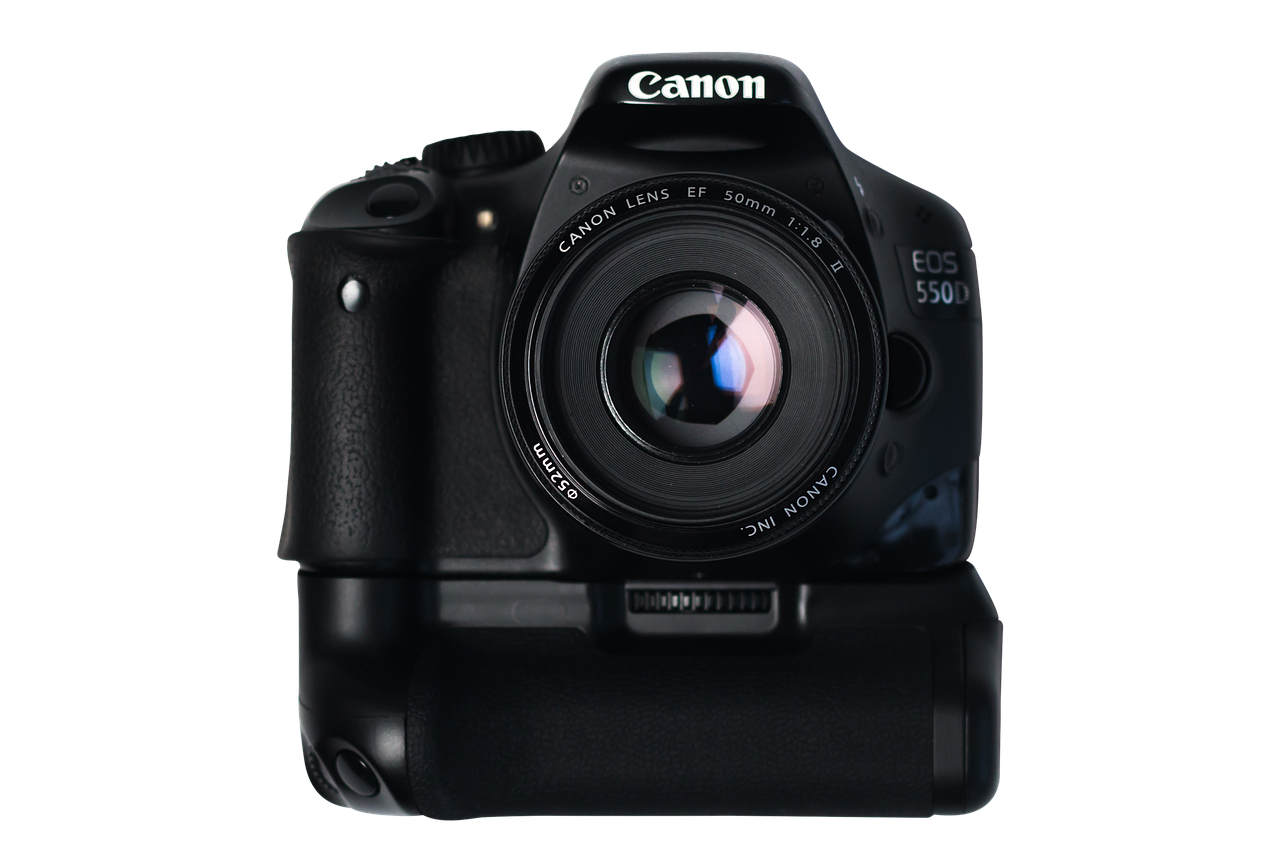 a digital camera sitting on top of a table, a picture, canon 5 d, in front of a black background, front profile!!!!, camera shutter iris