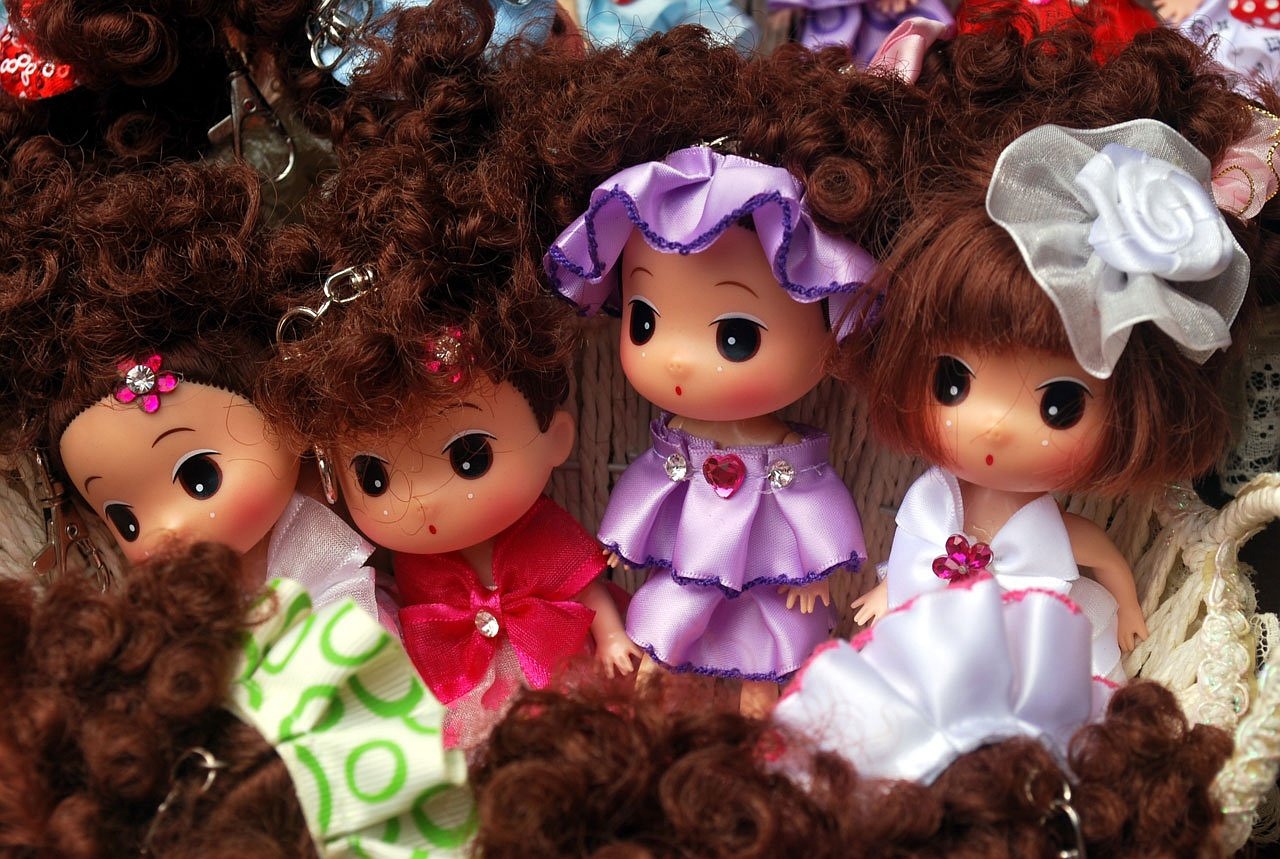 a group of dolls sitting next to each other, flickr, toyism, kawaii hairstyle, brown curly hair, precious moments, market