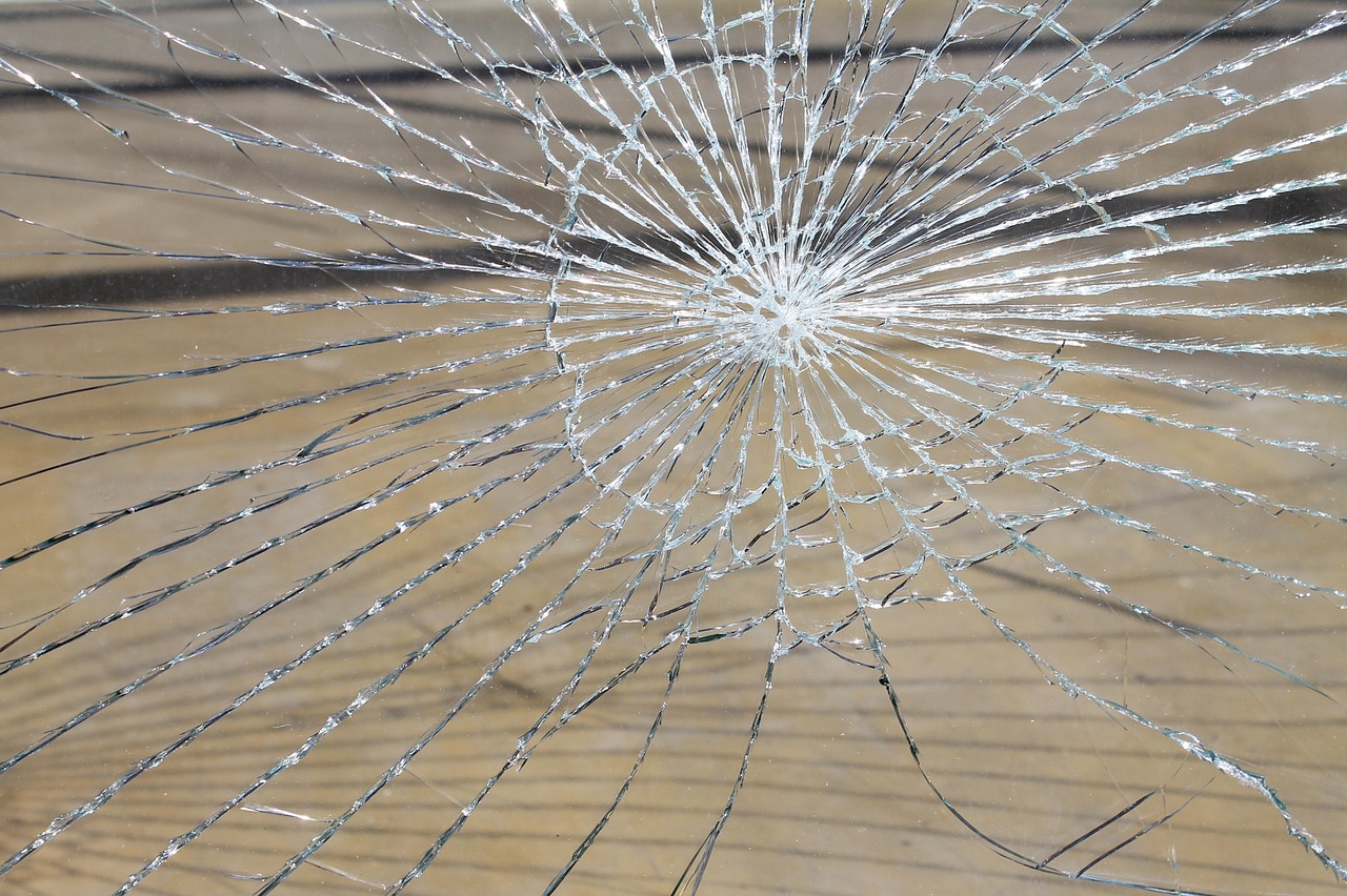 a broken glass window sitting on top of a wooden floor, a picture, by Joseph-Marie Vien, istockphoto, mesh wire, cracked mirror, on a sunny day