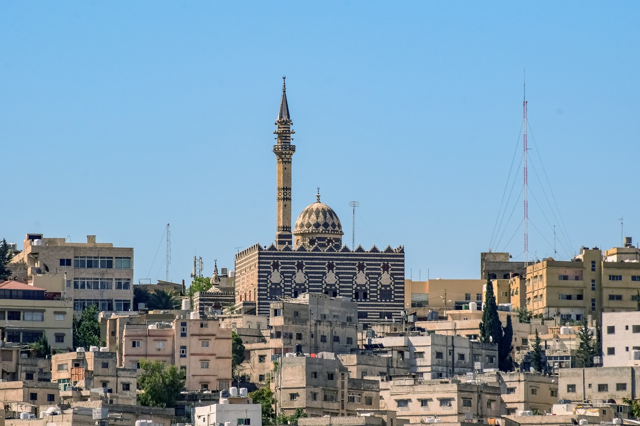 a large building in the middle of a city, by Ibram Lassaw, shutterstock, dau-al-set, seen from afar, al - qadim, lead - covered spire, israel