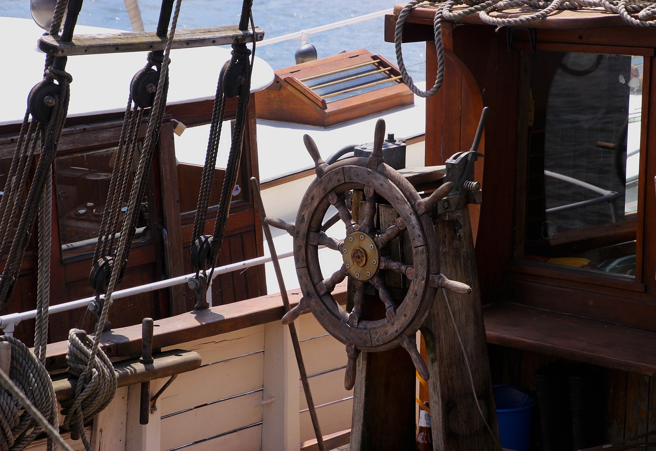 a close up of a steering wheel on a boat, by Edward Corbett, pixabay, renaissance, wooden sailboats, by greg rutkowski, tools, high res photo