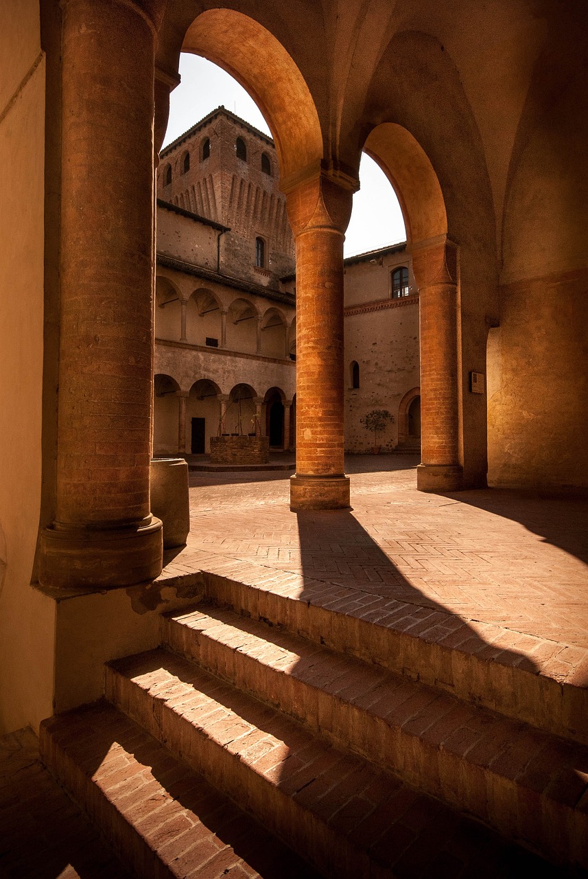 the sun shines through the arches of a building, a picture, inspired by Taddeo Gaddi, shutterstock, inside a castle courtyard, soft shadows, brick, monastery