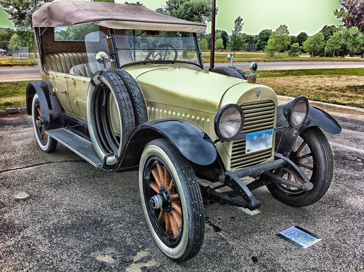 an old car is parked in a parking lot, a colorized photo, by Scott M. Fischer, flickr, 1 9 2 0 s cloth style, taken on iphone 14 pro, convertible, complexly detailed