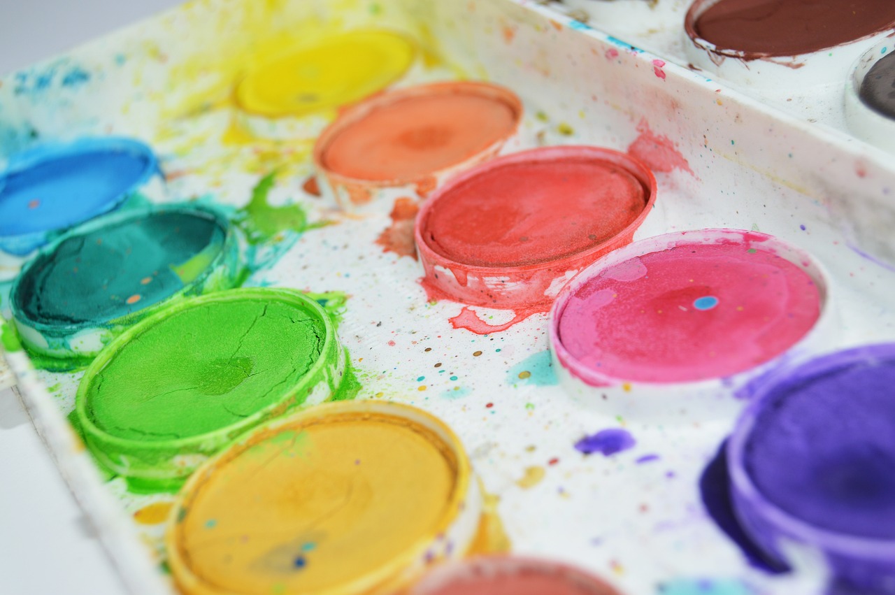 a close up of a box of paint on a table, a watercolor painting, pexels, full of colour 8-w 1024, drawing for children, palettes, canvas painting