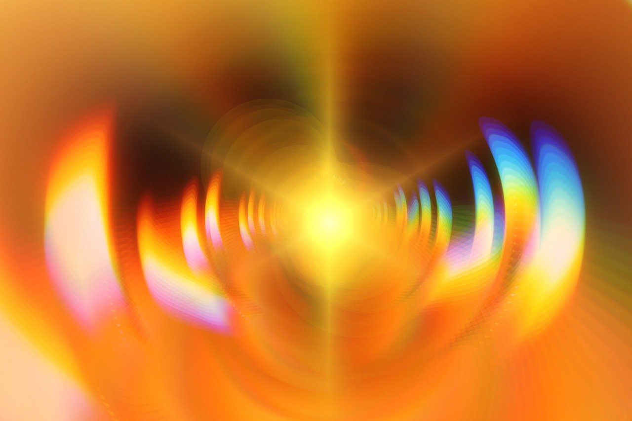 a blurry image of a heart shaped object, by Jan Rustem, abstract illusionism, fractal fire background, digital yellow red sun, light at the end of the tunnel, flash photo
