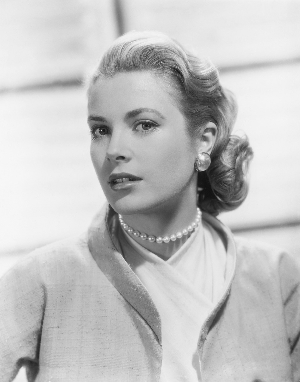 a black and white photo of a woman, a portrait, by Peter Basch, shutterstock, grace kelly, square, wearing pearl earrings, lapel
