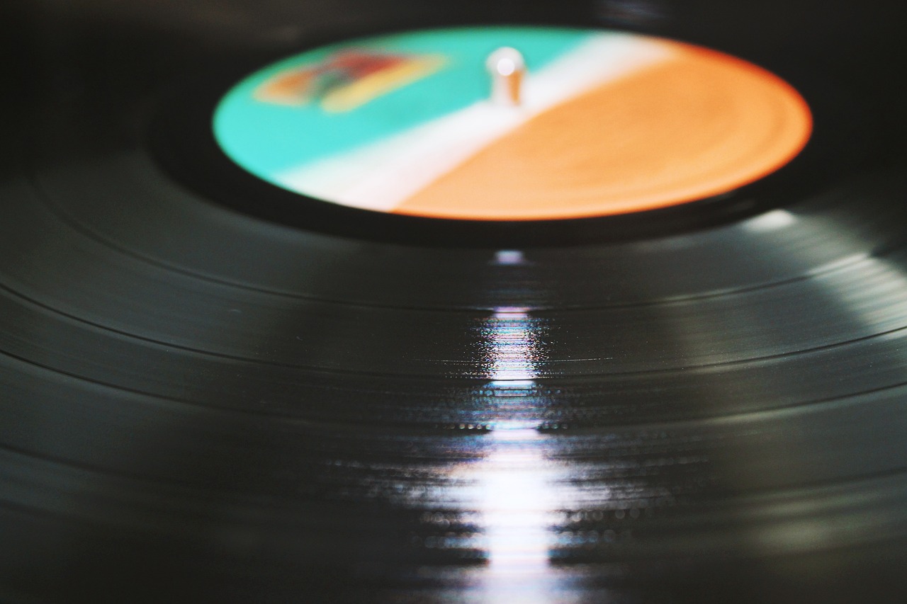 a vinyl record sitting on top of a table, an album cover, pexels, zoomed in, close up image, profile picture 1024px, jamming to music