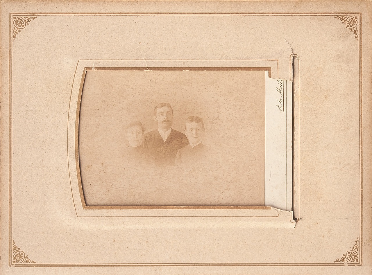 an old photo of a man and a woman, a polaroid photo, by Samuel Washington Weis, flickr, folk art, three women, face in focus 1 8 9 0's liminal, abstract people in frame, two young men