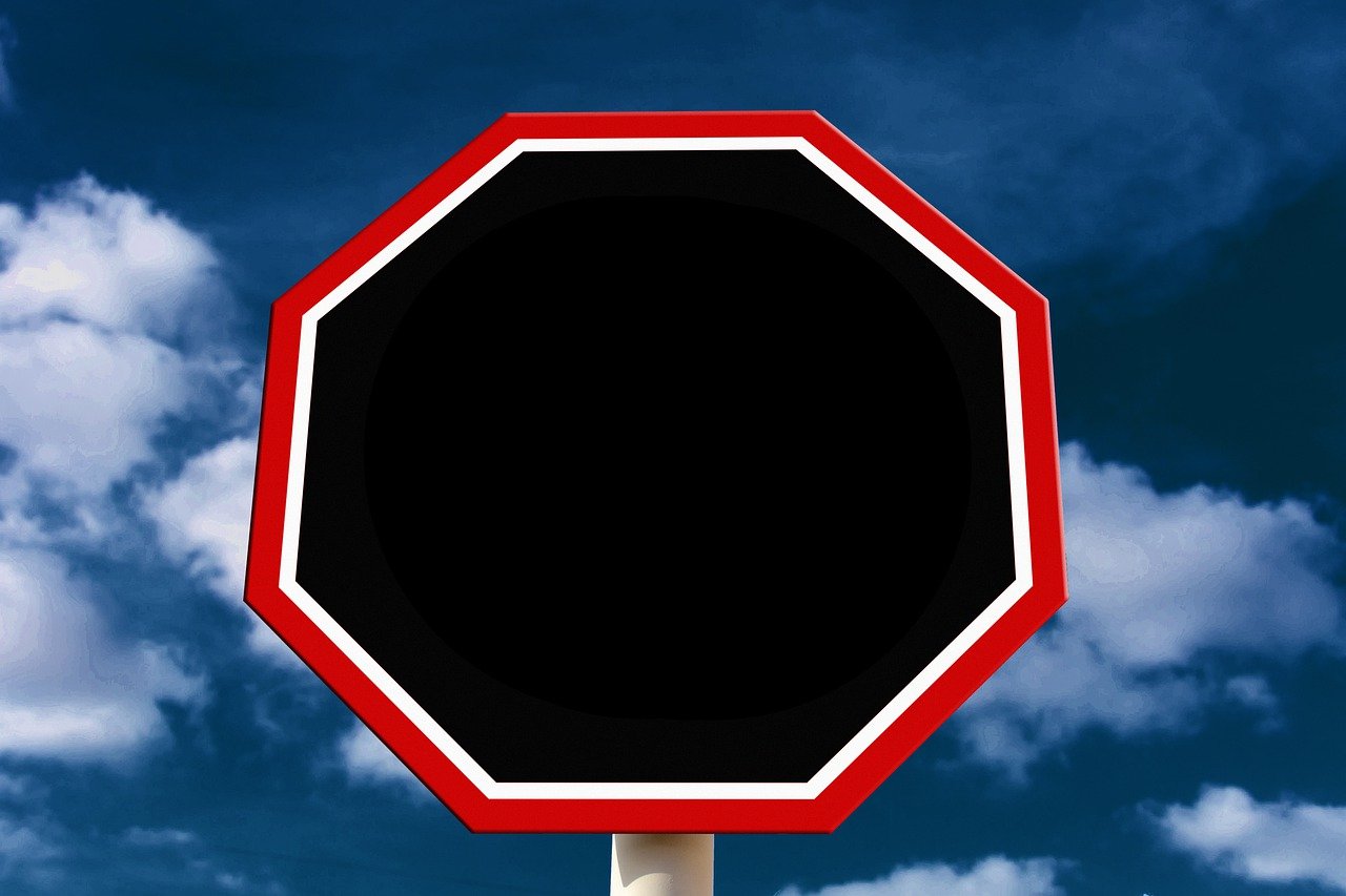 a red and white stop sign with a blue sky in the background, a stock photo, by Andrei Kolkoutine, postminimalism, in a black empty studio hollow, huge gargantuan black sun, hexagonal shaped, on a flat color black background