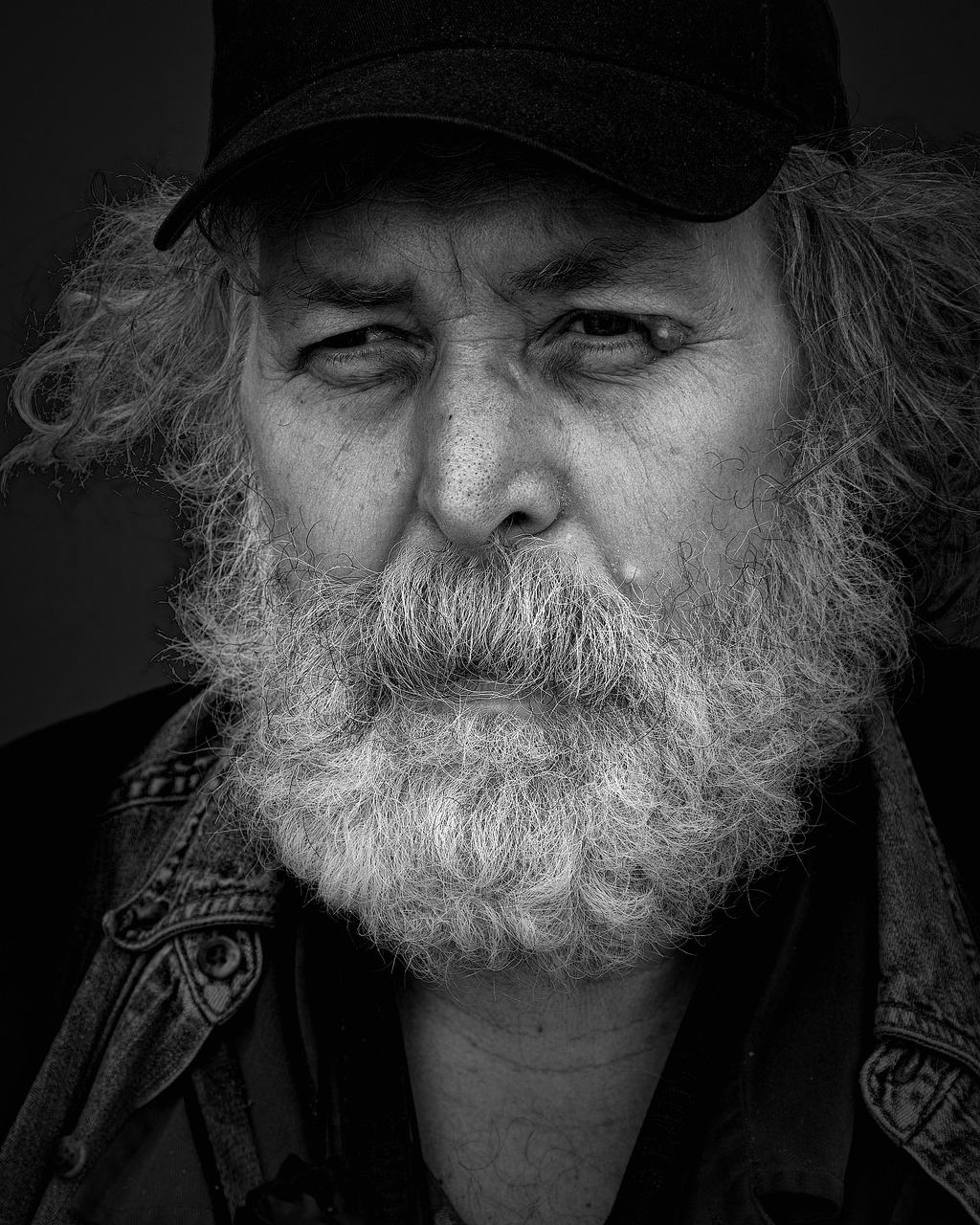 a black and white photo of a man with a beard, a character portrait, by Andrew Geddes, featured on pixabay, donald trump as a homeless man, taken with sony alpha 9, jerry garcia, color photograph portrait 4k