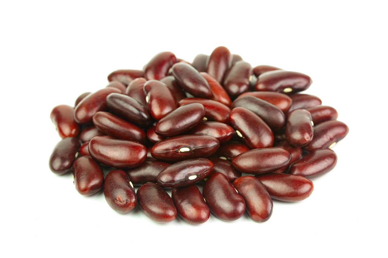 a pile of red beans on a white surface, mingei, productphoto, smooth oval head, jamaican, detailed product photo