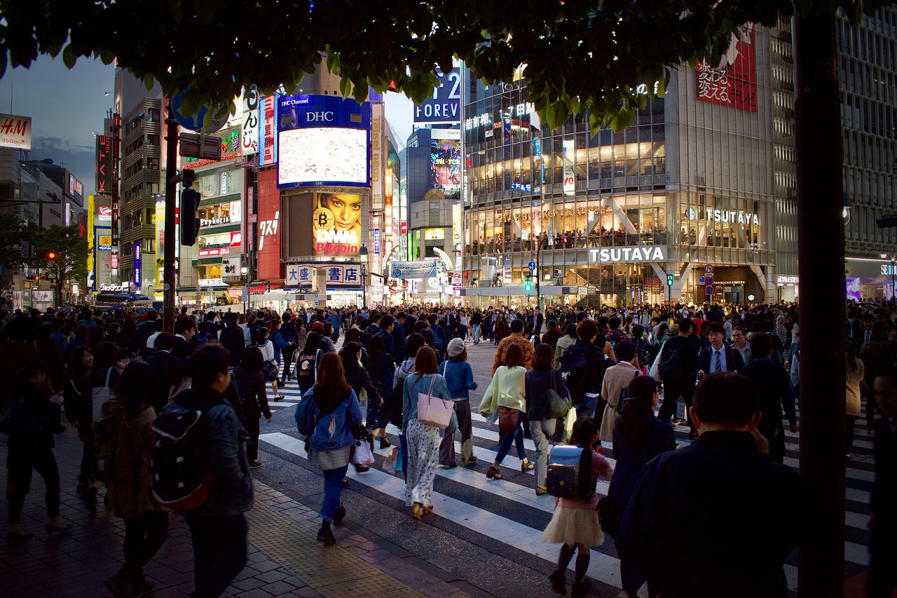a crowd of people walking across a street at night, a photo, by Adam Manyoki, shutterstock, neo tokyo background, beautiful sunny day, in 2 0 1 2, stock photo