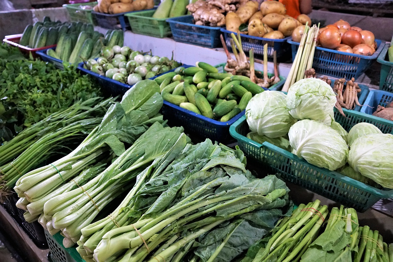 a market filled with lots of different types of vegetables, an elegant green, choi, in a row, malaysian