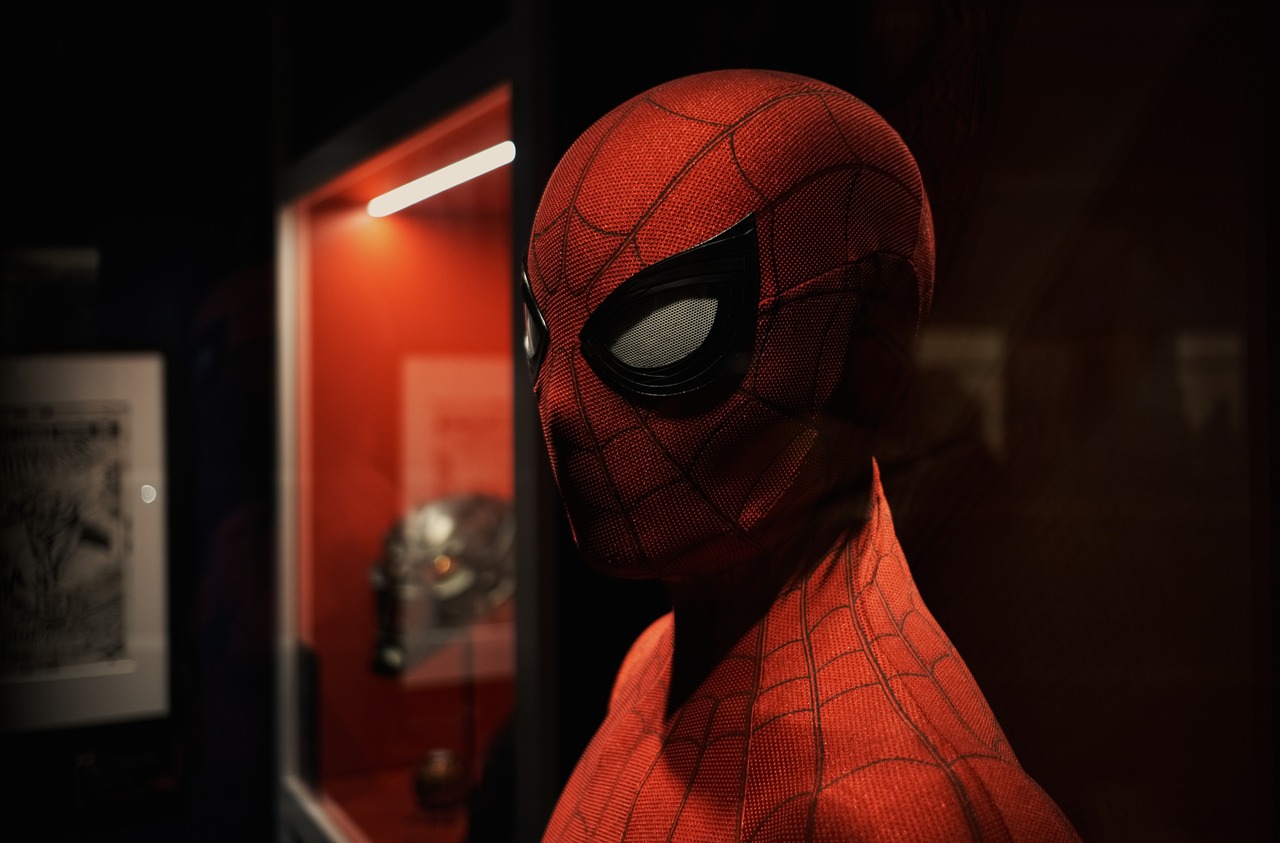 a close up of a person wearing a spider - man mask, photorealism, hev suit, museum photoshot, marvel studios, cinematic specular lighting
