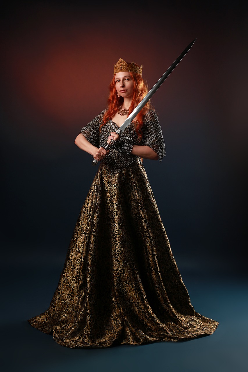 a woman in a dress holding a sword, inspired by Charles Gleyre, trending on cg society, pre-raphaelitism, armour and crown, young redhead girl in motion, royal brocade dress, high quality theatre costume