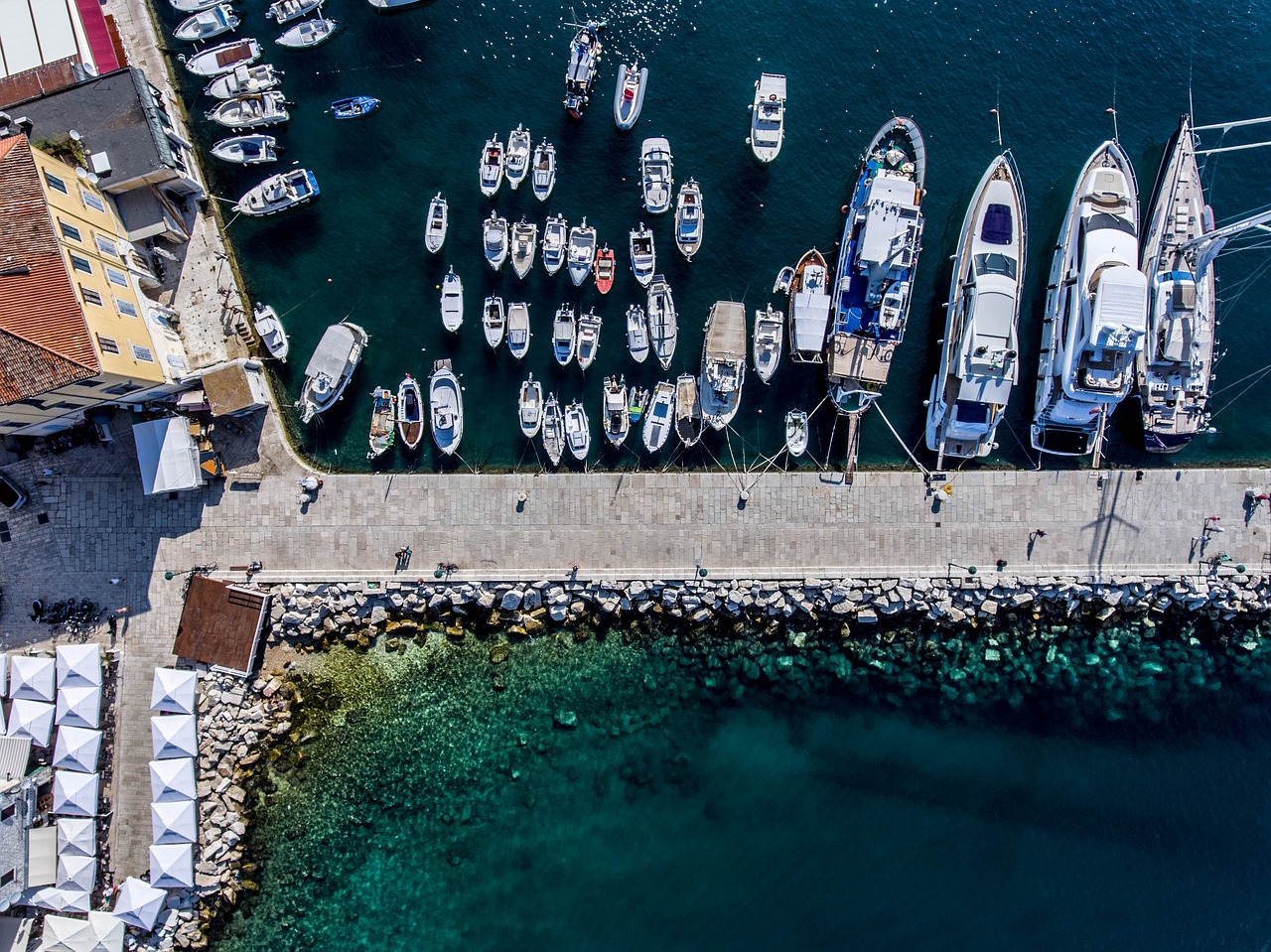 a number of boats in a body of water, pexels contest winner, docked at harbor, wide overhead shot, mina petrovic, istock