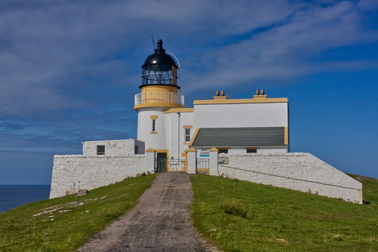 a white and yellow lighthouse sitting on top of a hill, a portrait, by Robert Fawcett, flickr, a road leading to the lighthouse, biggish nose, spherical, copper