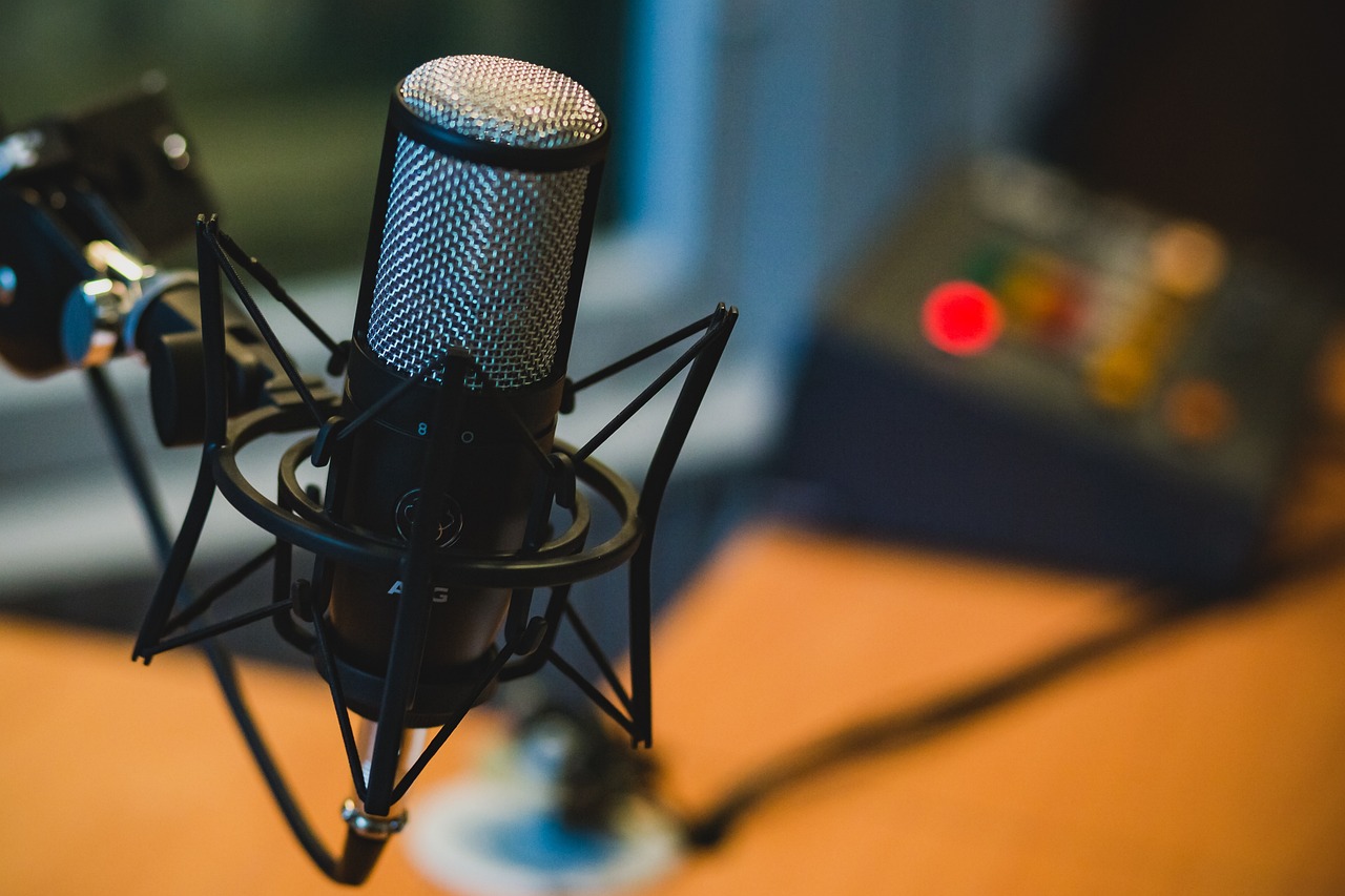 a microphone sitting on top of a wooden table, by Konrad Witz, shutterstock, happening, patreon content, screenshots, in a studio, radio box