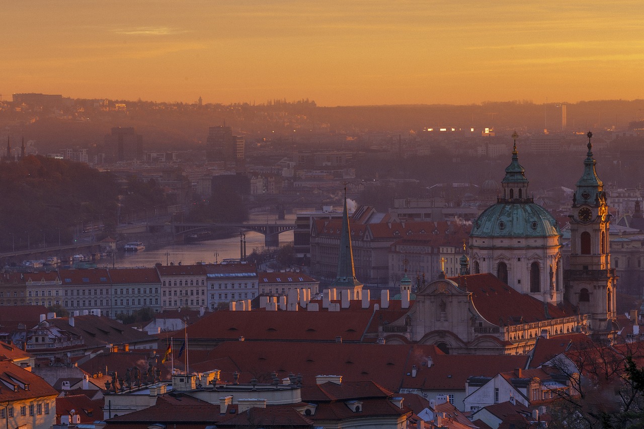 a view of a city from the top of a hill, by Sebastian Spreng, pexels contest winner, happening, orange dawn, prague, shot on 1 5 0 mm, img _ 9 7 5. raw